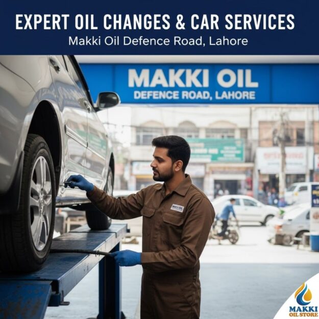 Close-up of a Pakistani technician in uniform checking a car engine lifted on a jack, with the Makki Oil Defence Road branch sign visible. Text overlay: "Expert Oil Changes & Car Services. Makki Oil Defence Road, Lahore.